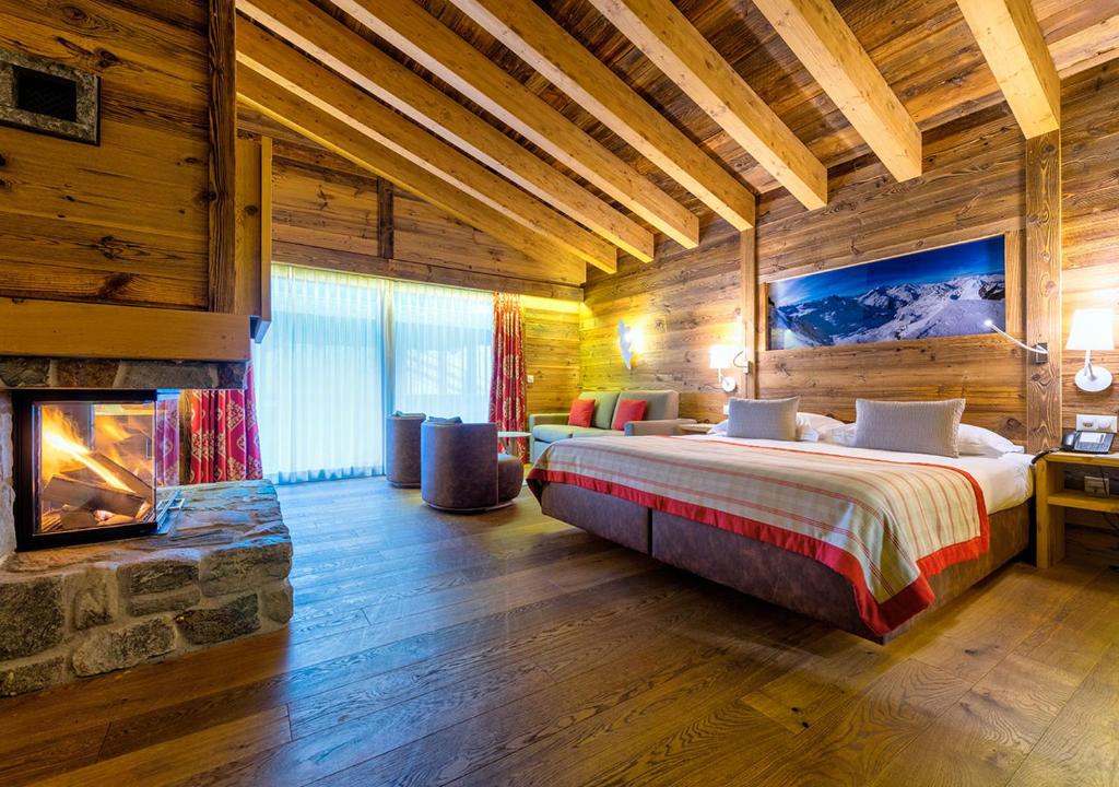 Postel nebo postele na pokoji v ubytování Nendaz 4 Vallées & SPA 4* Superior
