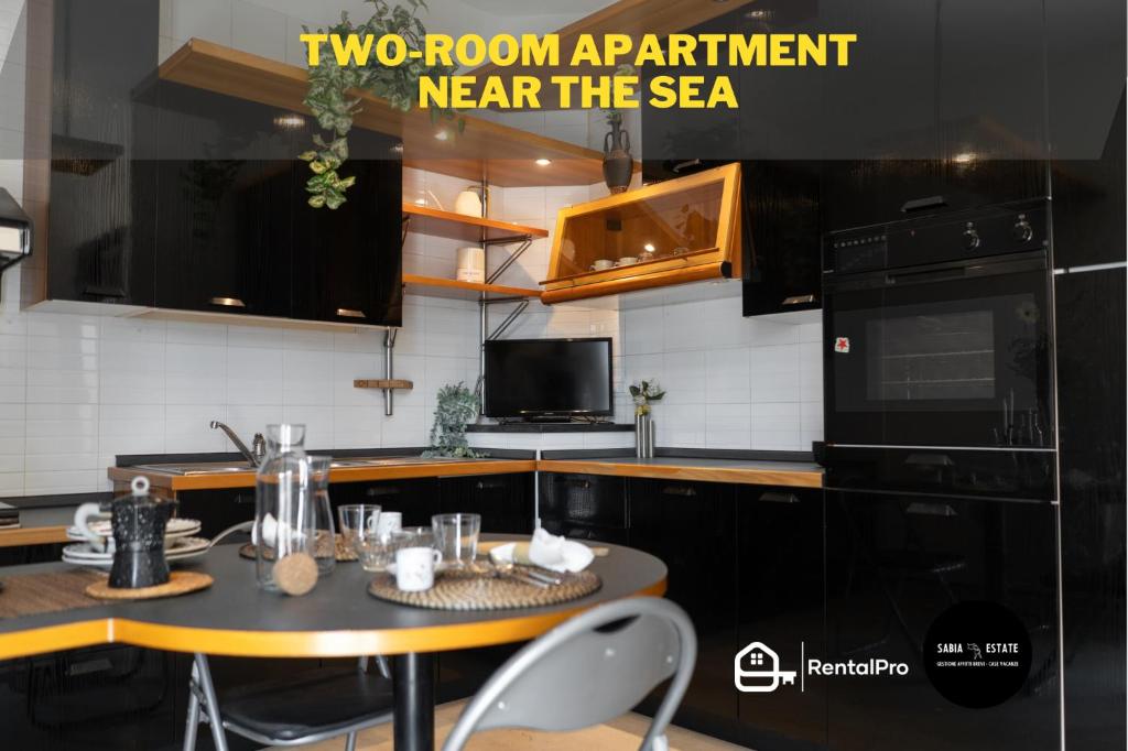 two room apartment near the sea in a kitchen at [V.LE DELLA REPUBBLICA] Bilocale vicino al mare. in Pietra Ligure