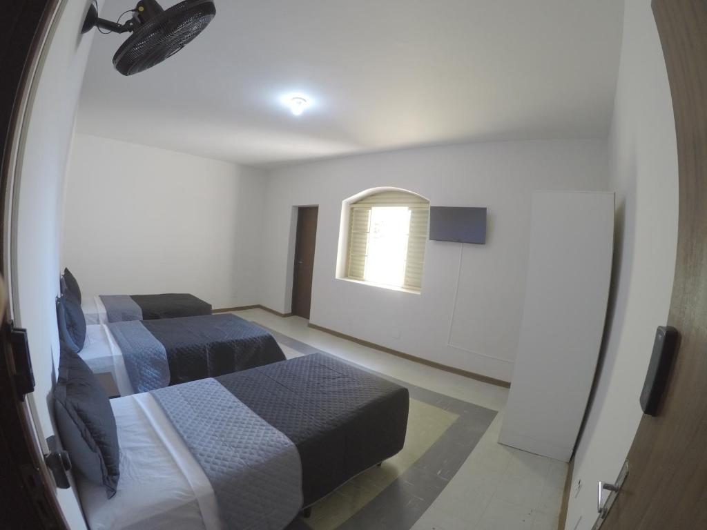 Quartos Delfim Moreira - Habitación Triple Estándar