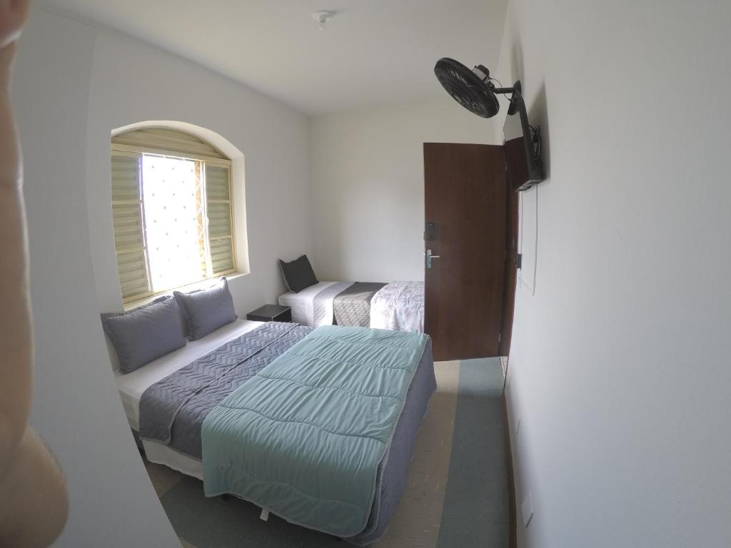 Quartos Delfim Moreira - Habitación Triple Estándar