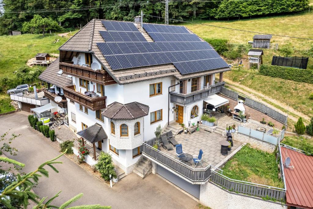an aerial view of a house with solar panels on the roof at Haus Weber in Hölzberg