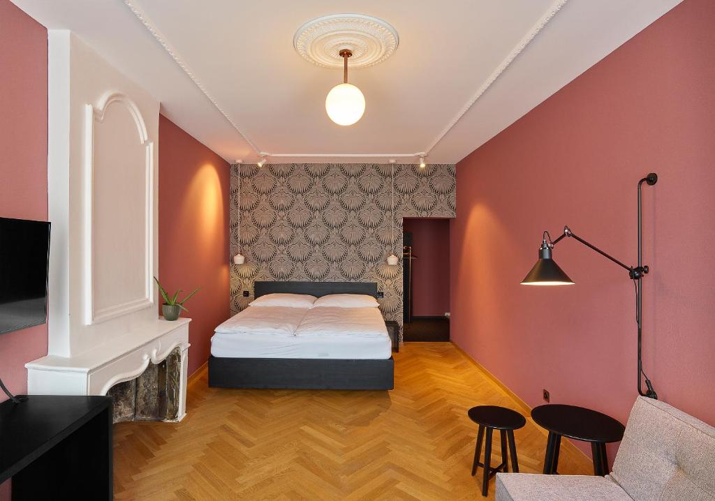 Postel nebo postele na pokoji v ubytování ADLER Boutique Hotel