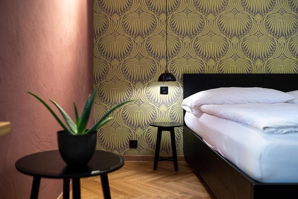 Postel nebo postele na pokoji v ubytování ADLER Boutique Hotel