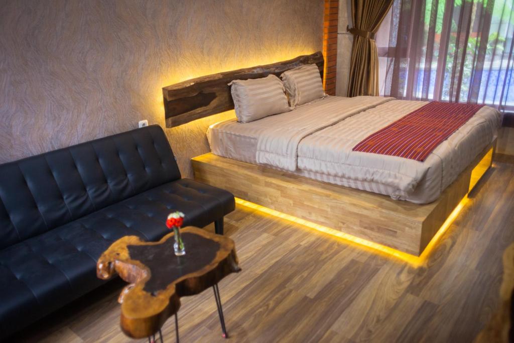 Postel nebo postele na pokoji v ubytování Pariban Hotel