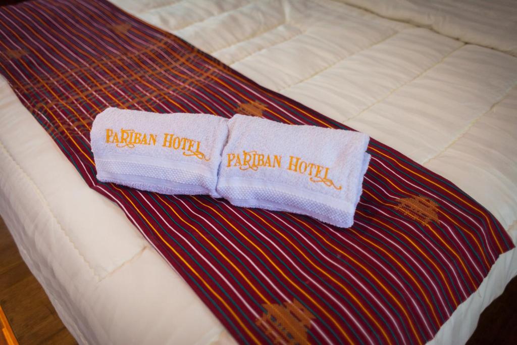 Postel nebo postele na pokoji v ubytování Pariban Hotel