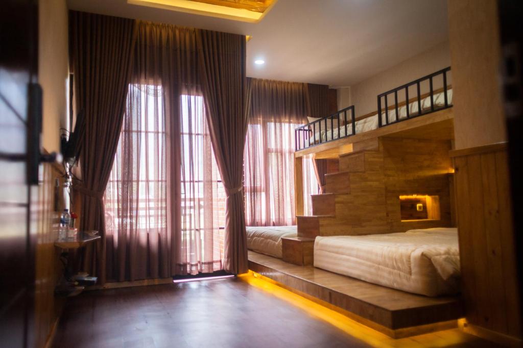 Postel nebo postele na pokoji v ubytování Pariban Hotel