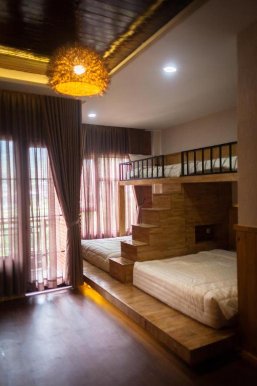 Postel nebo postele na pokoji v ubytování Pariban Hotel