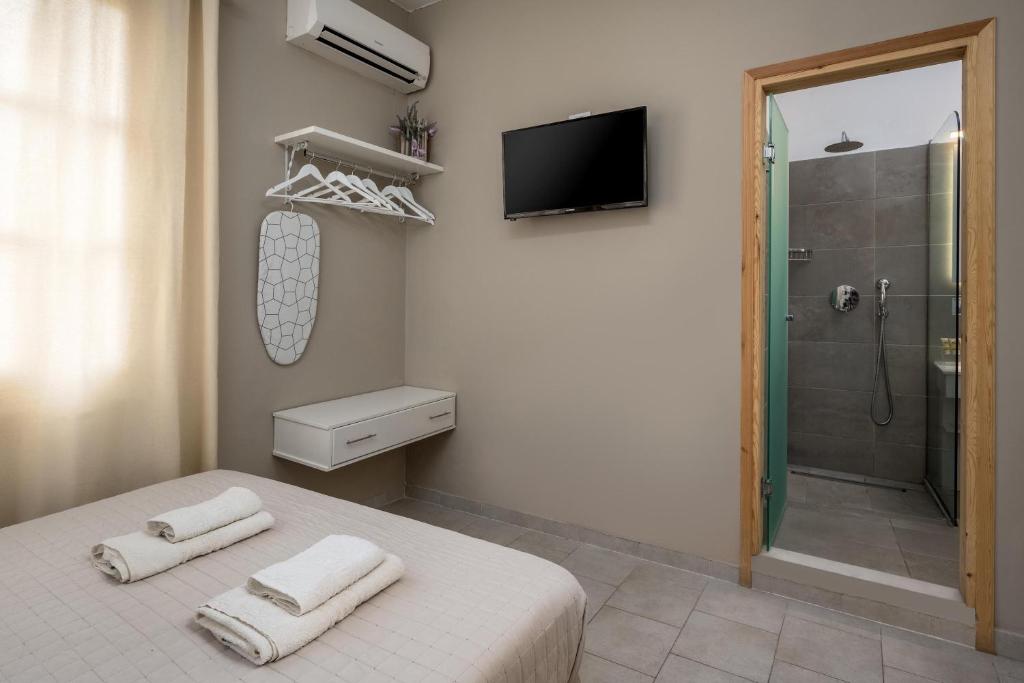 Koupelna v ubytování Maravelia's Rooms