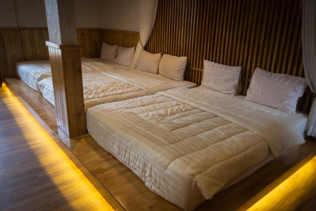 Postel nebo postele na pokoji v ubytování Pariban Hotel