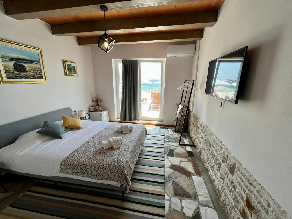 Postel nebo postele na pokoji v ubytování San Marco Rooms Umag