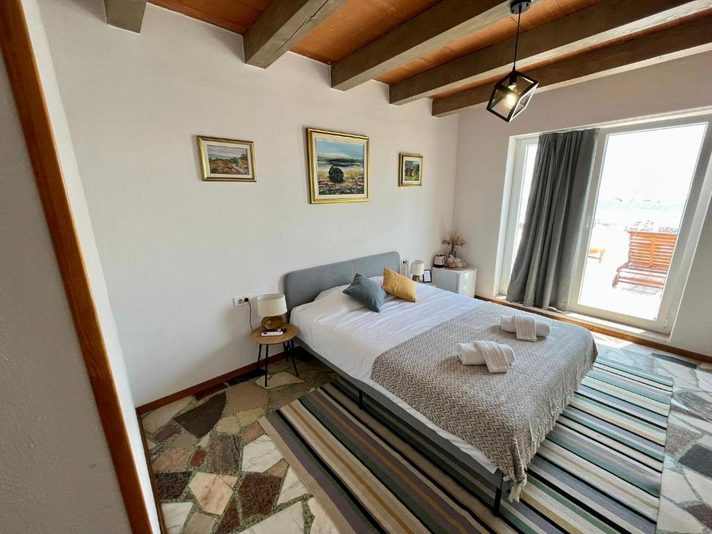 Postel nebo postele na pokoji v ubytování San Marco Rooms Umag