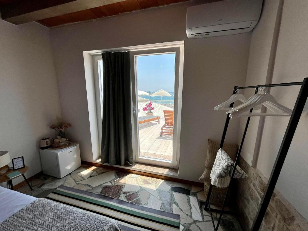 Postel nebo postele na pokoji v ubytování San Marco Rooms Umag