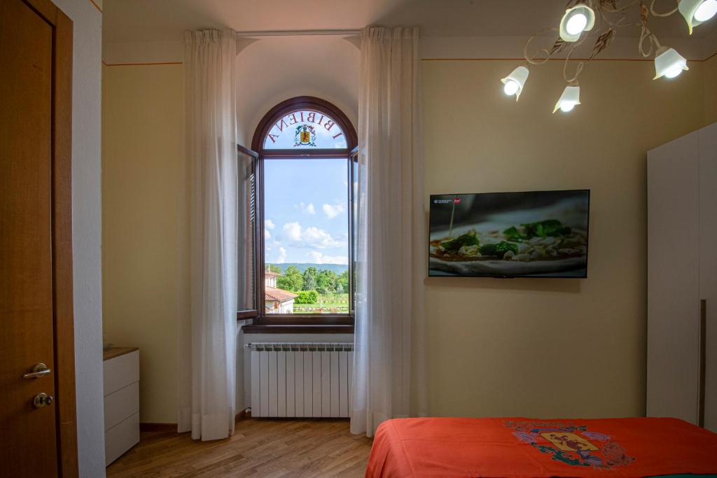 Postel nebo postele na pokoji v ubytování IBibiena - CASA CAMALDOLI