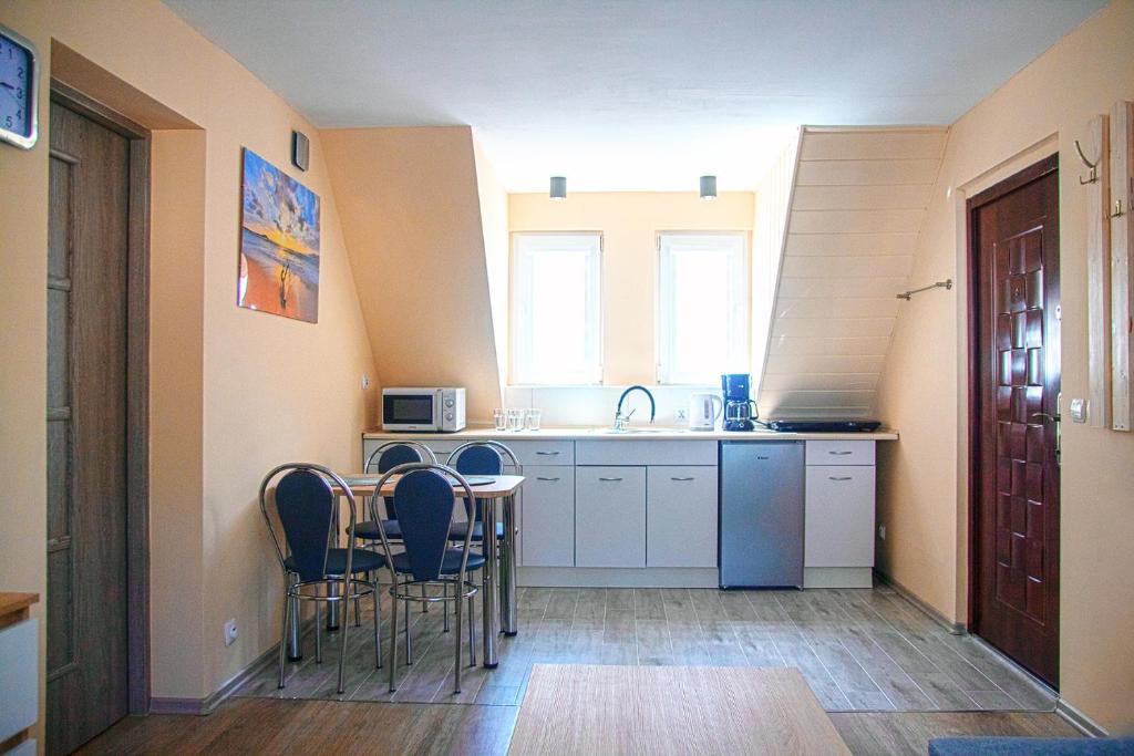 Kuchyň nebo kuchyňský kout v ubytování Sztil - Apartamenty i drewniane domki