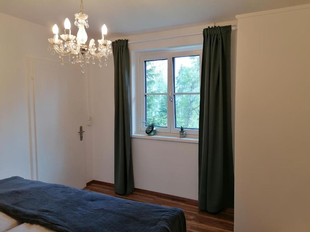 Postel nebo postele na pokoji v ubytování Ferienhaus Tauernblick