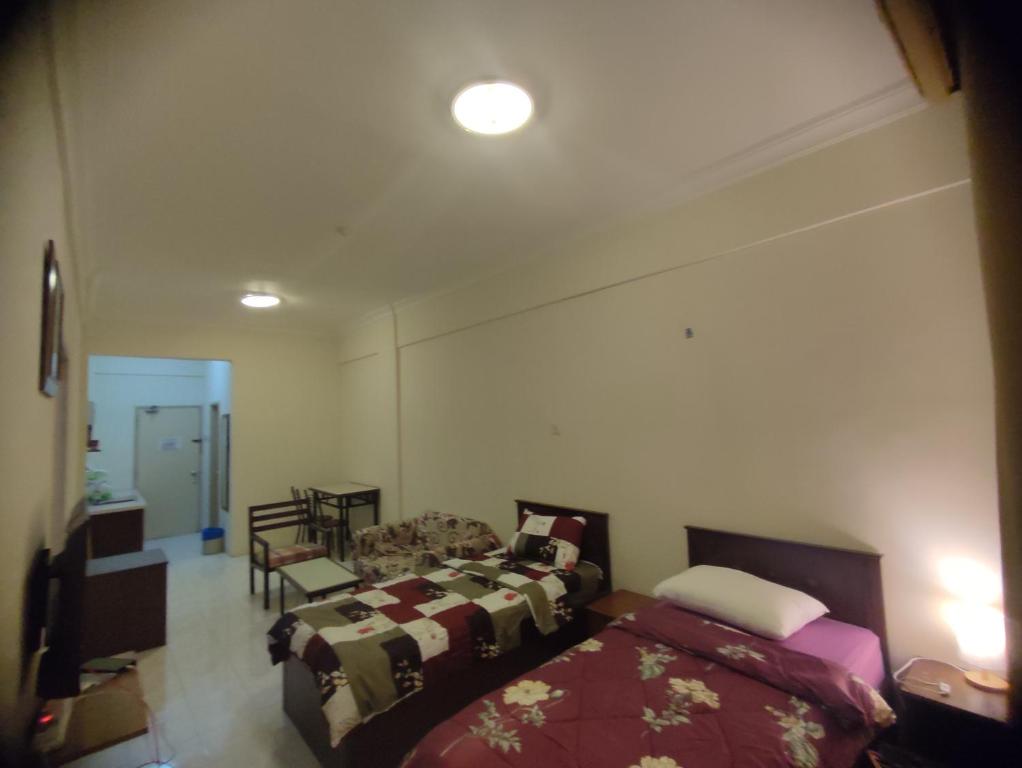 Кровать или кровати в номере Sofea Inn Bukit Merah - Laketown A6172