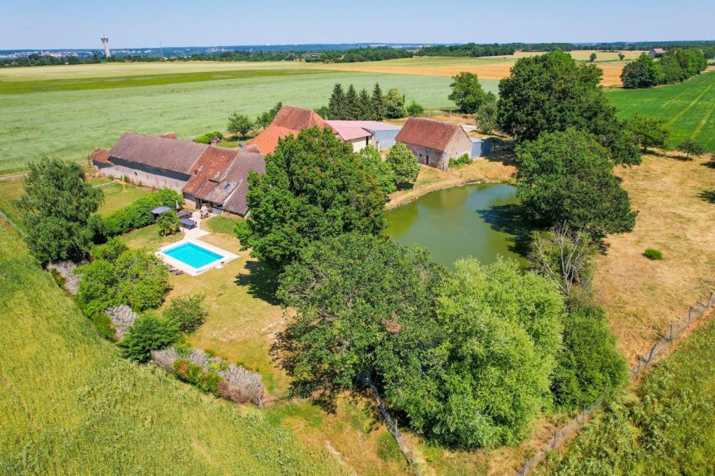 an aerial view of a house with a pond at Crazy Villa Gouadiere 45 - Heated pool - Basket - 1h45 from Paris - 30p in Poilly-lez-Gien
