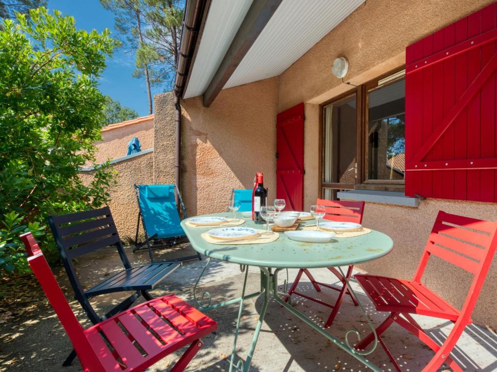 a table and chairs sitting on a patio at Holiday Home Les As-9 by Interhome in Lacanau-Océan