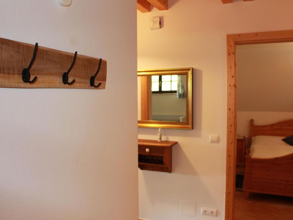A bed or beds in a room at Apartment Schwalbennest by Interhome