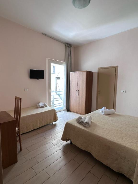 Postel nebo postele na pokoji v ubytování Hotel Adria Nuova