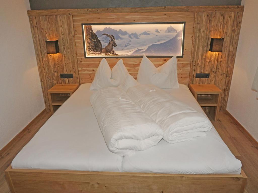 A bed or beds in a room at Apartment Ladis-11 by Interhome