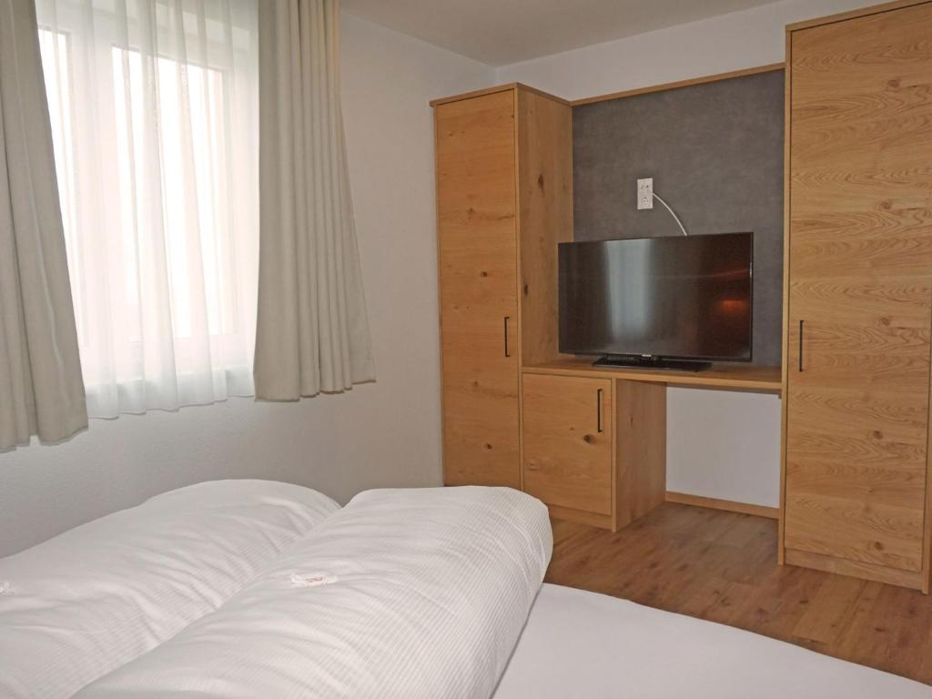 A television and/or entertainment centre at Apartment Ladis-11 by Interhome