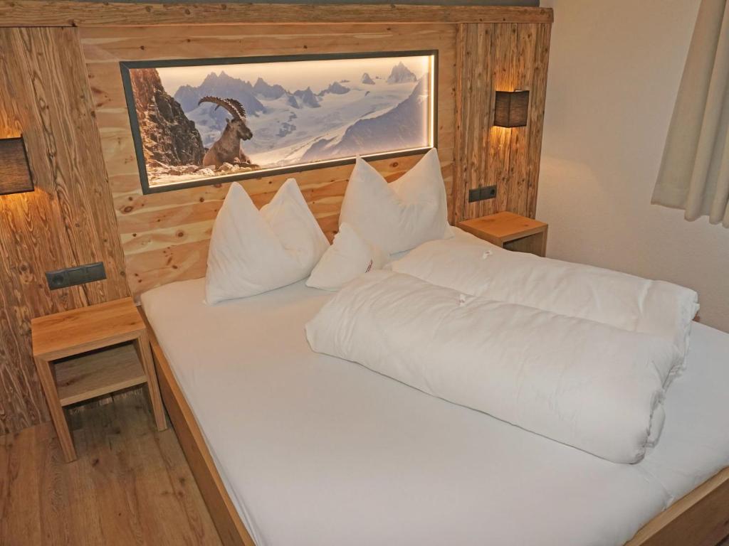 A bed or beds in a room at Apartment Ladis-11 by Interhome