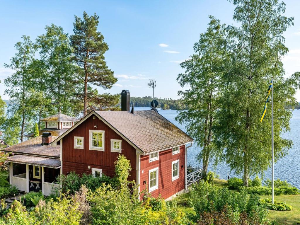 a house on the shore of a lake at Chalet Villa Lundsfjärden - VML120 by Interhome in Grythyttan