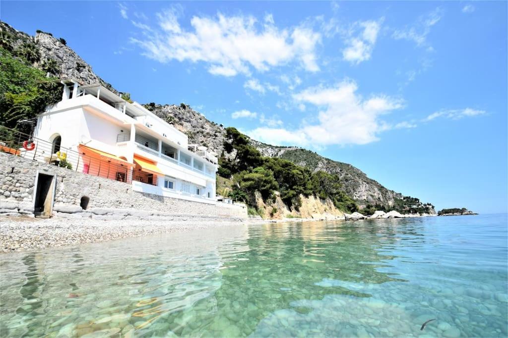 a house on the shore of a beach at FRONT BEACH PENTHOUSE in Èze