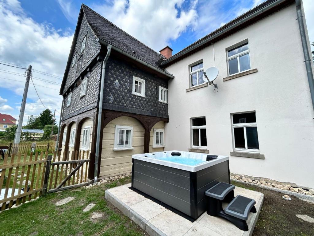 a house with a hot tub in the yard at Apartment Ornella by Interhome in Großschönau