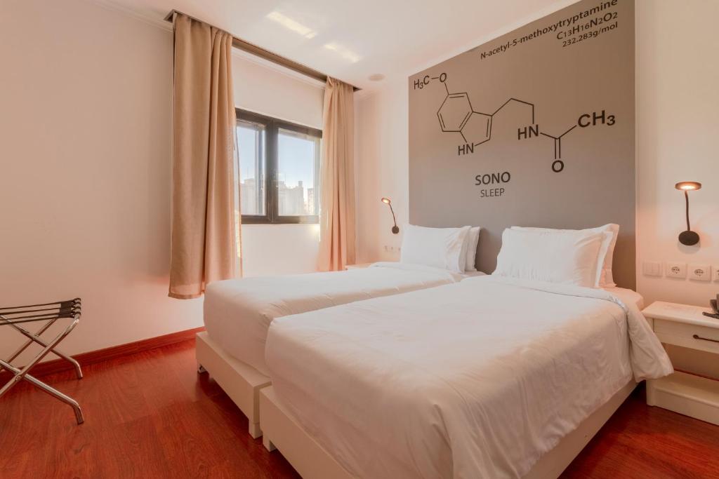 Postel nebo postele na pokoji v ubytování Hotel A.S. Lisboa