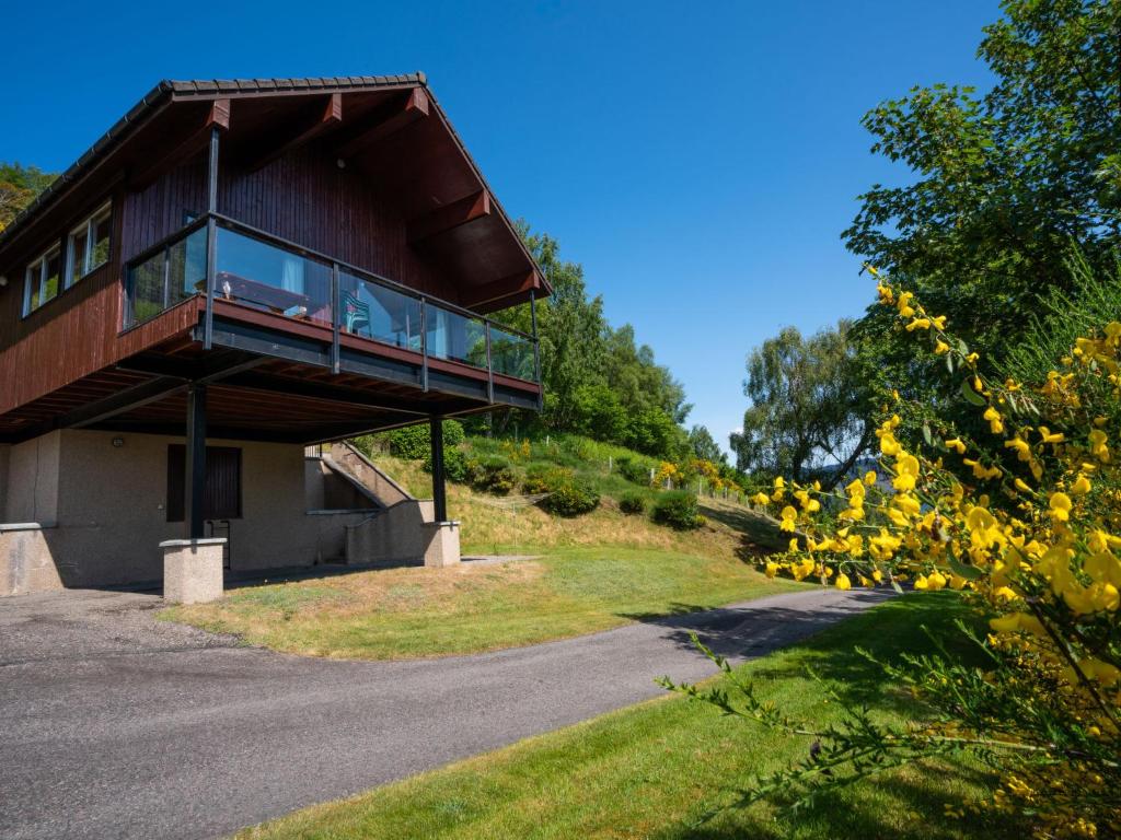 a house on a hill with a balcony at Holiday Home Achmony Type 2-3 by Interhome in Drumnadrochit