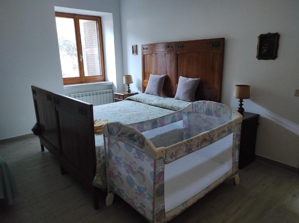 Posteľ alebo postele v izbe v ubytovaní Il Ciliegio Holiday Apartment With Garden
