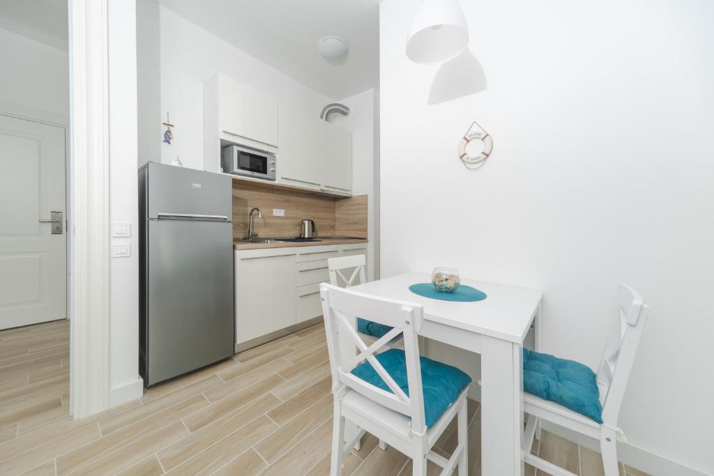 Kuchyň nebo kuchyňský kout v ubytování La barca apartments