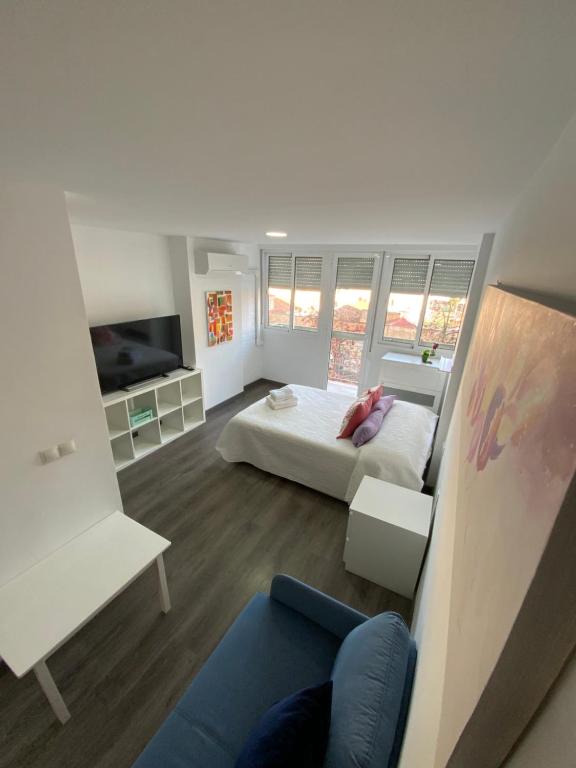 Łóżko lub łóżka w pokoju w obiekcie HEROE APARTAMENTO