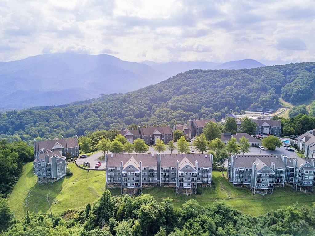 an aerial view of a large house in the mountains at SKY HIGH VIEWS!!-Peak Mountaintop-Outdoor Pool-Close to Downtown-Private Balcony-WiFi-Cable in Gatlinburg