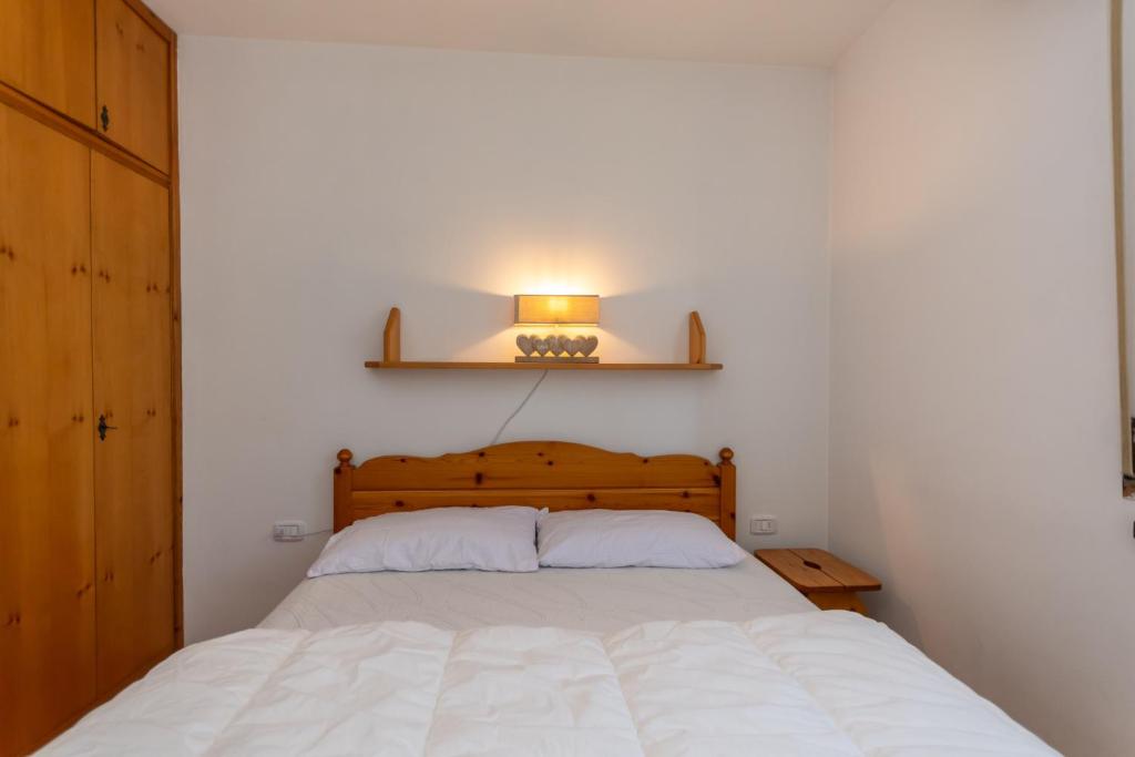 Postel nebo postele na pokoji v ubytování Residenza Latemar