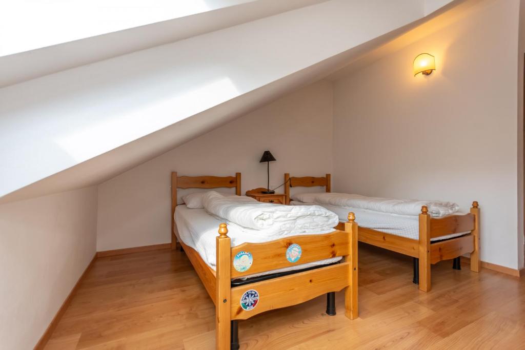 Postel nebo postele na pokoji v ubytování Residenza Latemar