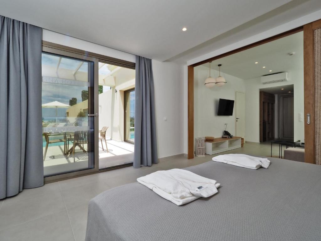 Postel nebo postele na pokoji v ubytování Hotel Athina