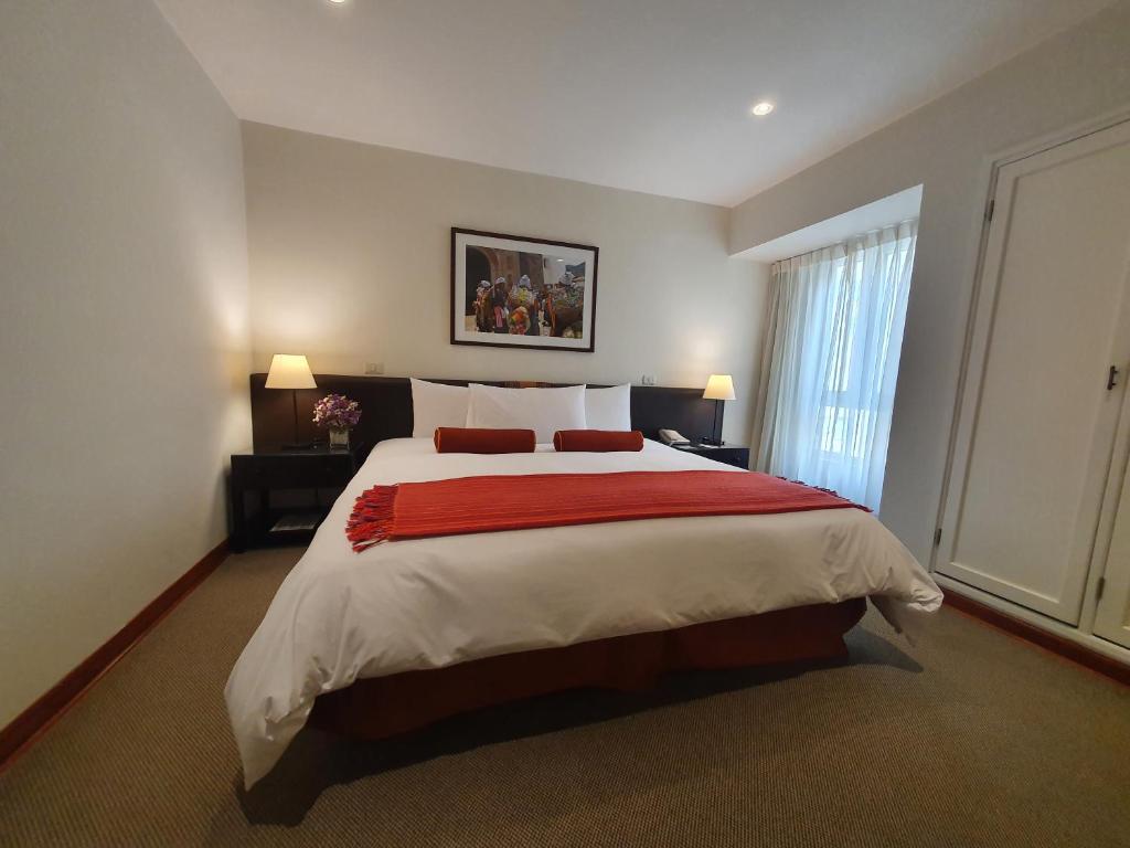 Postel nebo postele na pokoji v ubytování LP Los Portales Hotel Cusco
