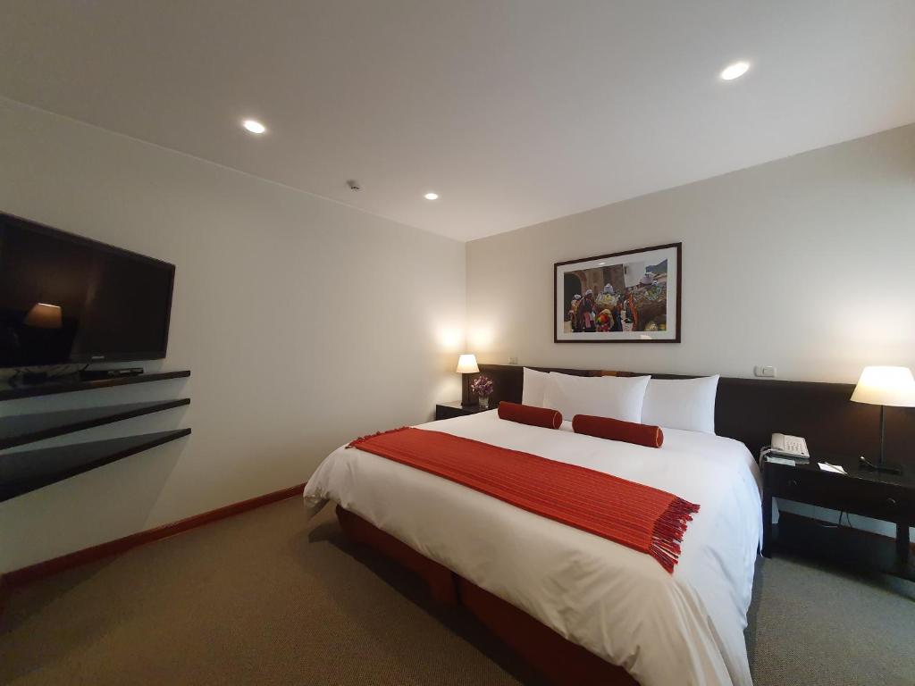Postel nebo postele na pokoji v ubytování LP Los Portales Hotel Cusco