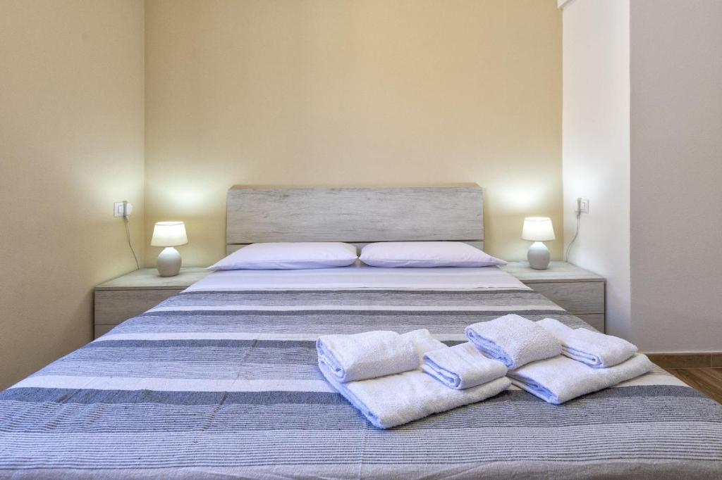 Posteľ alebo postele v izbe v ubytovaní Vico Rooms