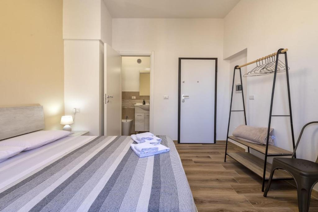 Posteľ alebo postele v izbe v ubytovaní Vico Rooms