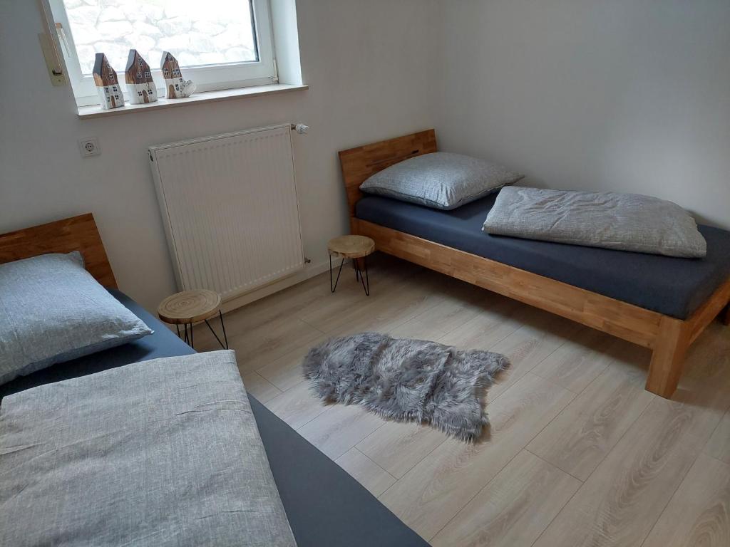 Postel nebo postele na pokoji v ubytování Ferienhaus Weitblick