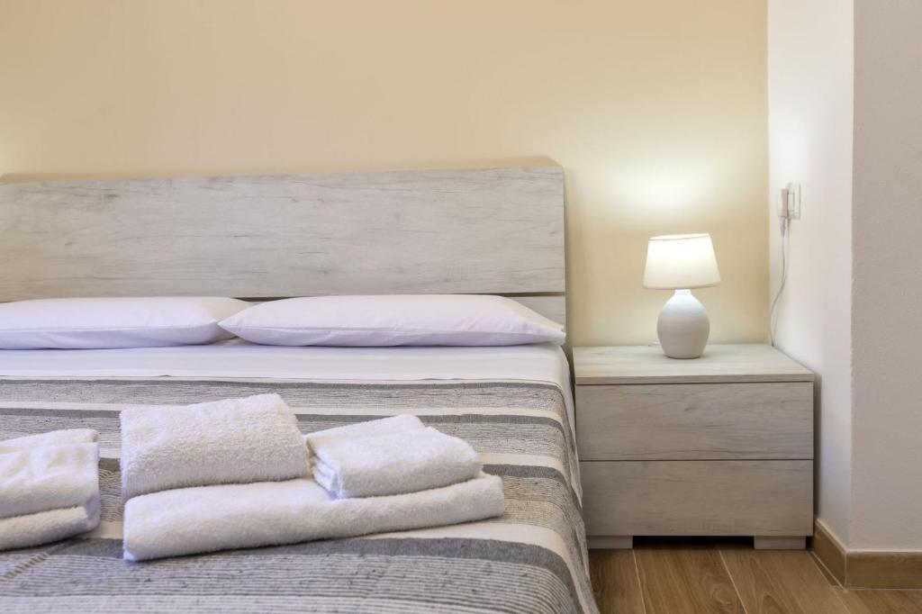 Posteľ alebo postele v izbe v ubytovaní Vico Rooms