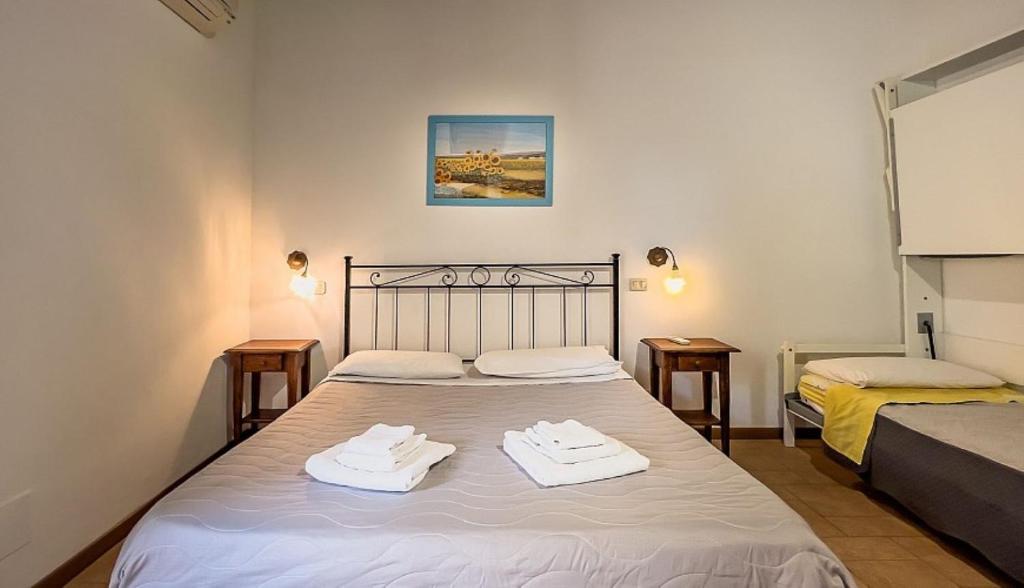 A bed or beds in a room at Agriturismo Al Girasole