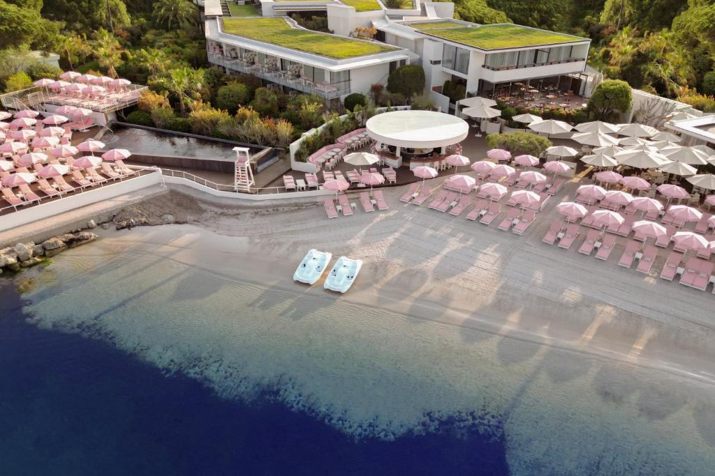 an aerial view of a resort with a swimming pool at Cap d'Antibes Beach Hotel in Juan-les-Pins