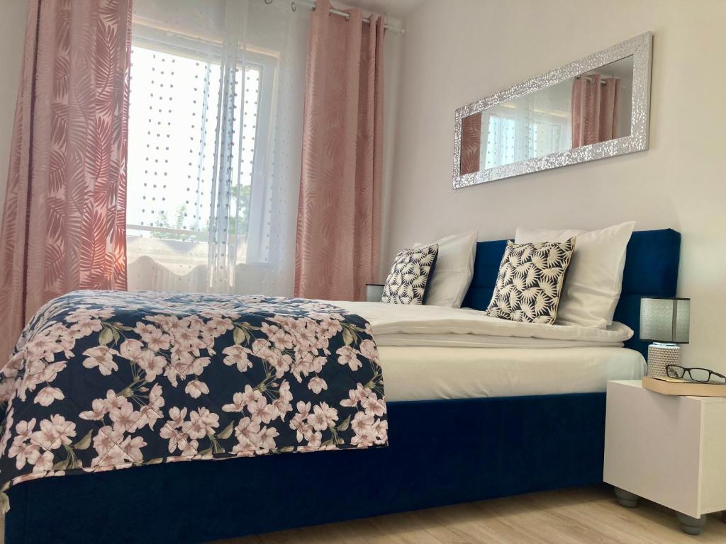 Posteľ alebo postele v izbe v ubytovaní Apartament nr 18 - Apartamenty Wakacyjna 5