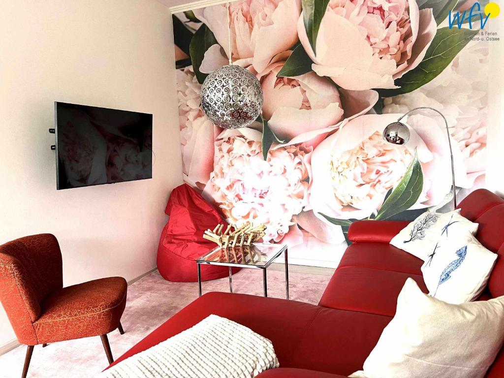 TV a/nebo společenská místnost v ubytování Villa Düna Ferienwohnung 5