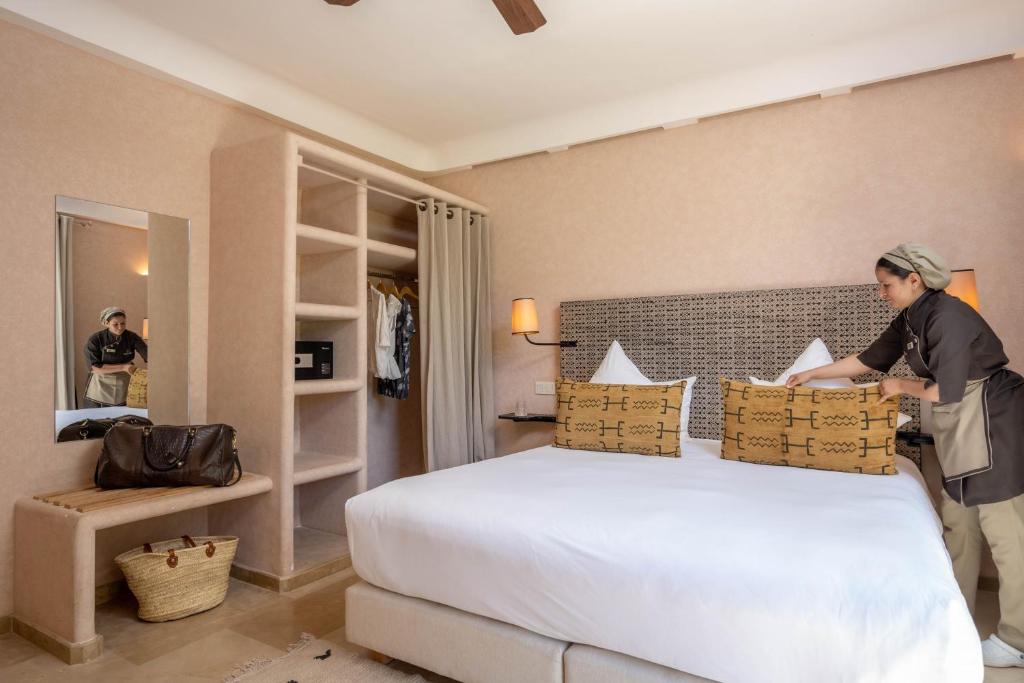 Postel nebo postele na pokoji v ubytování Oasis lodges